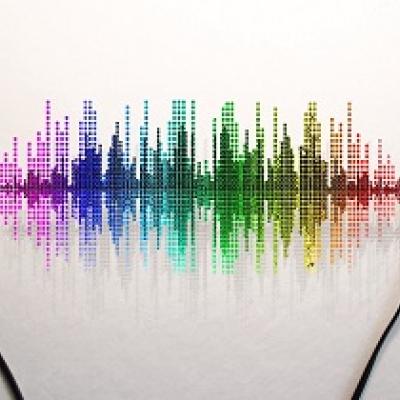 Ear buds with a rainbow audio graph.