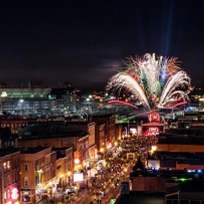Fireworks at night in a cityscape.