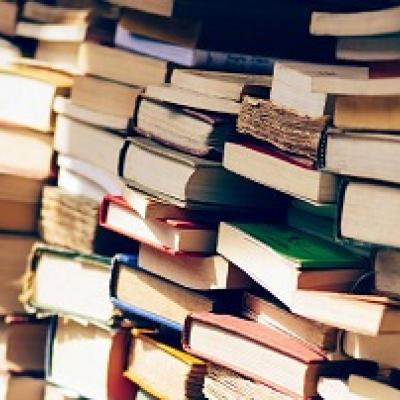 Stacks of books shown close up.