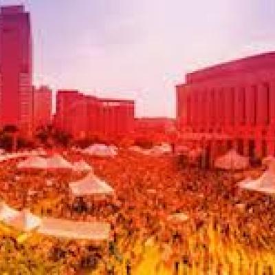 Distorted photo of public square park rendered in reds and yellows