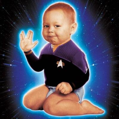small child posing with Vulcan hand gesture
