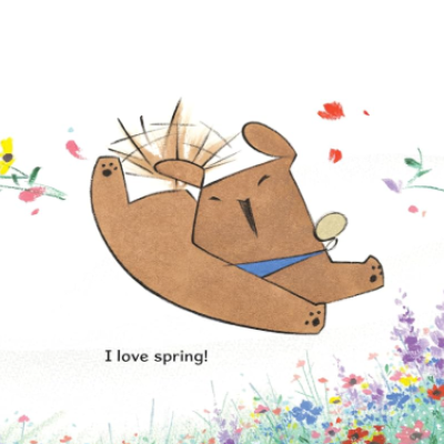 Little dog enjoys the spring flowers