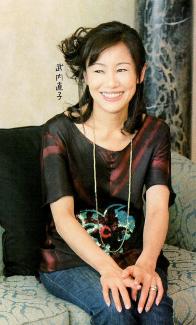 Naoko Takeuchi sitting on a sofa