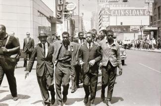 John Lewis marching for civil rights.