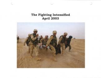 Soldiers carry an injured person off the field during the war in Iraq in 2003