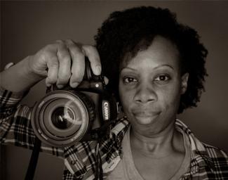 Woman holding a camera.