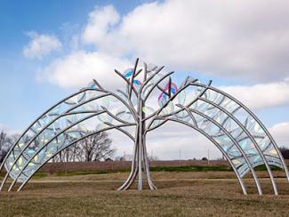 Great Beginnings, a large steel and glass sculpture.