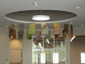 Continuum, a scuptulre made up of a series of acrylic, book-like tiles, with historical images from Goodlettsville and rust impressions from local items.