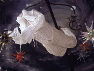 The Price is a mixed media sculpture, including heavy gauge aluminum wire, hanging from the ceiling. 