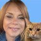 Joan Brasher holding an orange cat